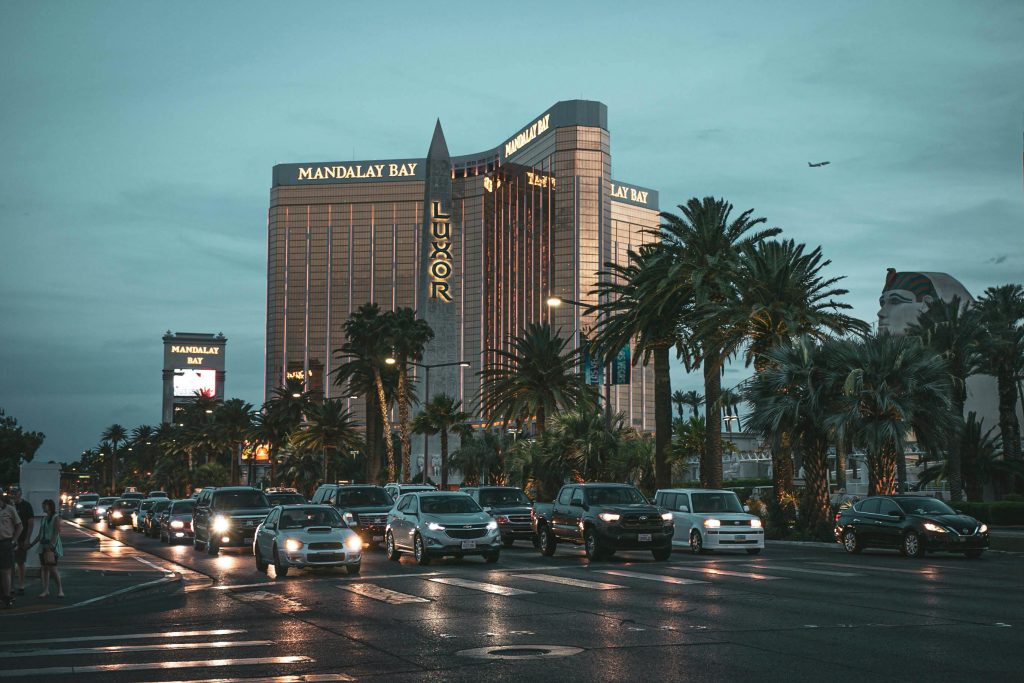 Evening view of Mandalay Bay with traffic in Las Vegas, showcasing a lively cityscape.